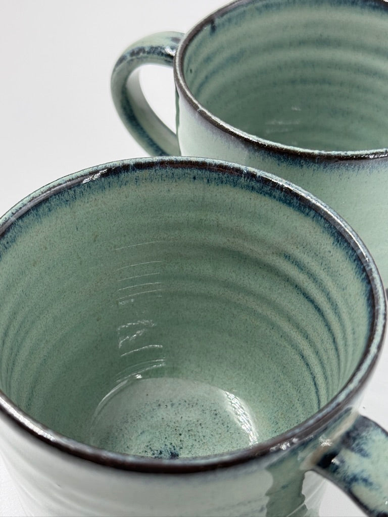 2 green mugs - medium/8oz